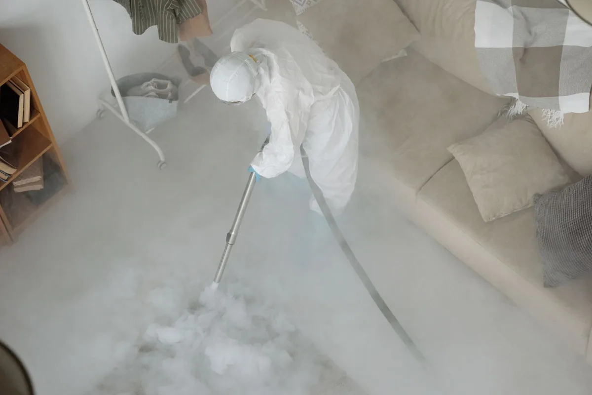 Biohazard cleanup technician in protective equipment, Piñon Hills, CA